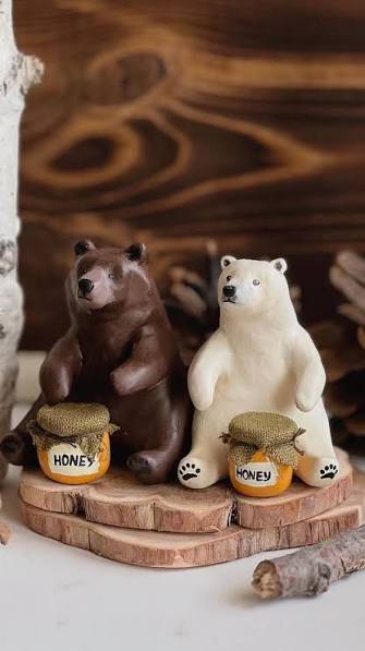 Bear Holding a Honey Jar